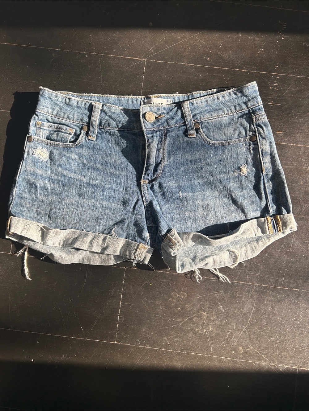 PAIGE Light Wash Rolled-Hem Distressed Denim Shorts